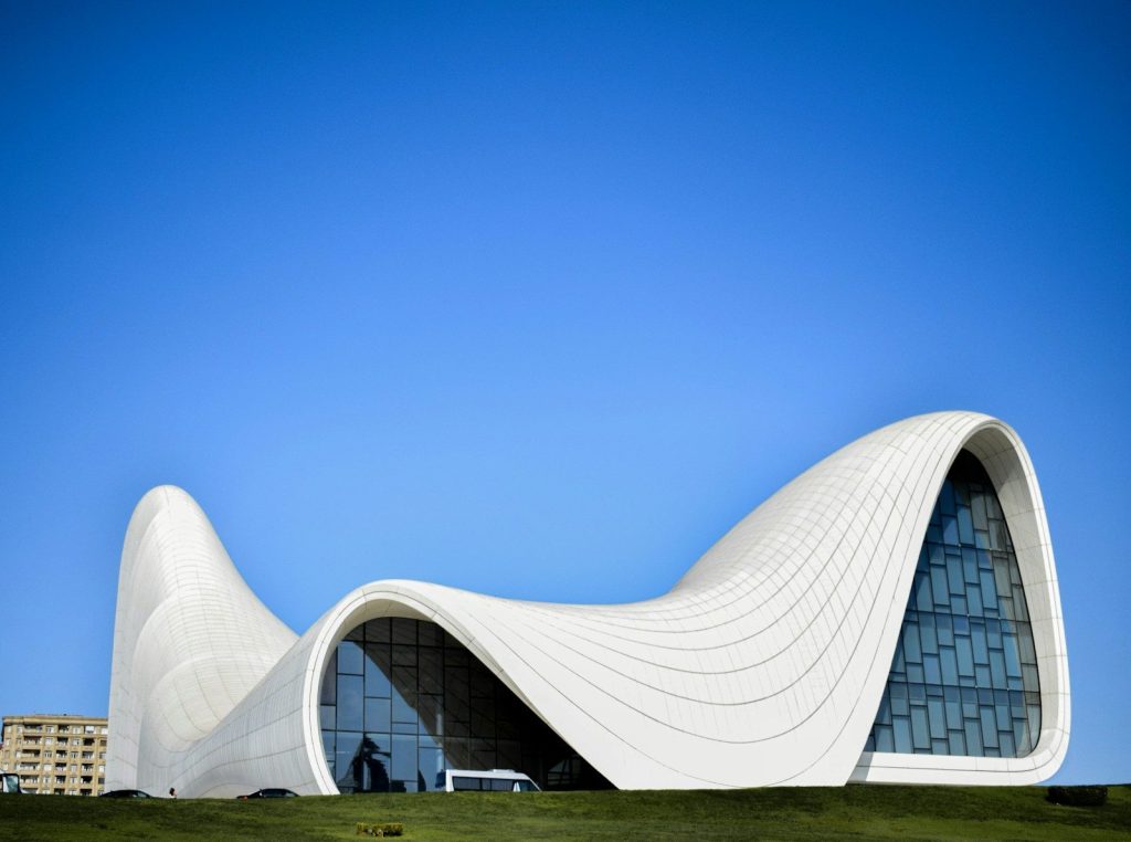 a large white building with a curved roof