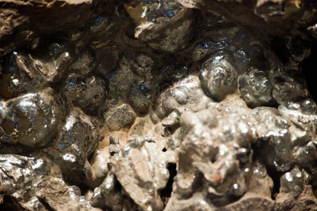 Close-up of metallic rock formations with shiny surfaces