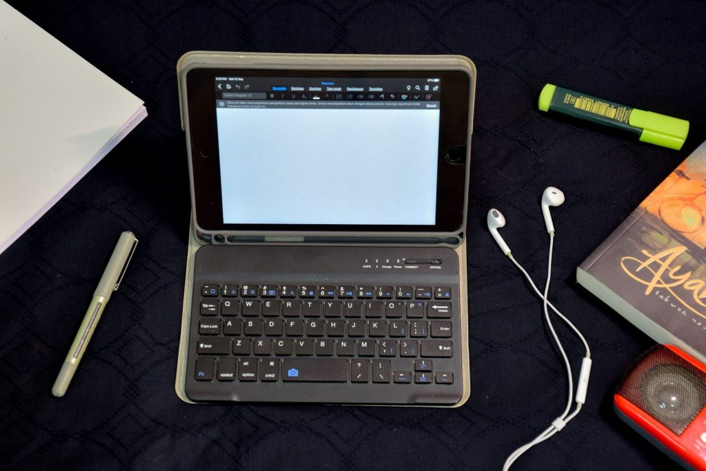 white samsung tablet computer with black smart keyboard