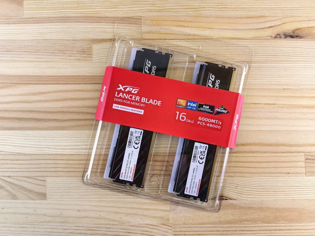 A couple of black and white knives in a package