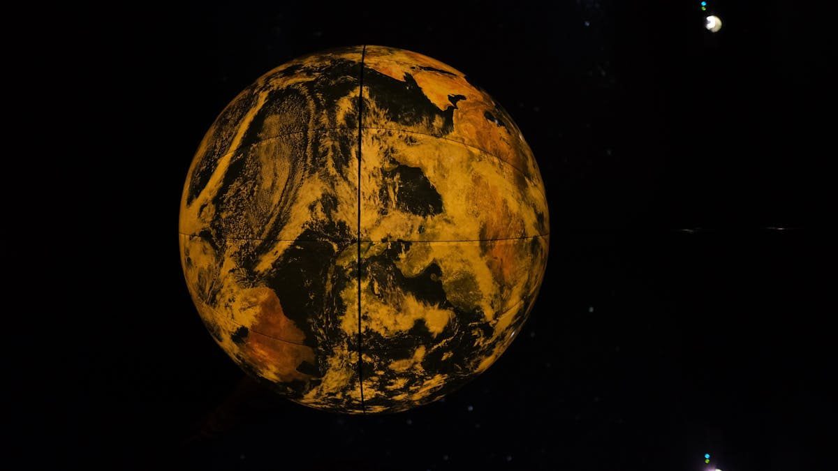 A dramatic depiction of Earth as an art piece with a black backdrop.