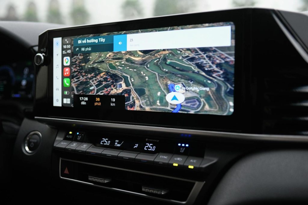 Modern in-car navigation system showing a digital map and route details.