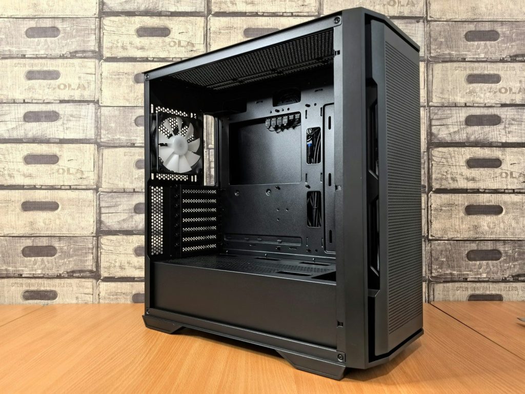 A black computer case sitting on top of a wooden table
