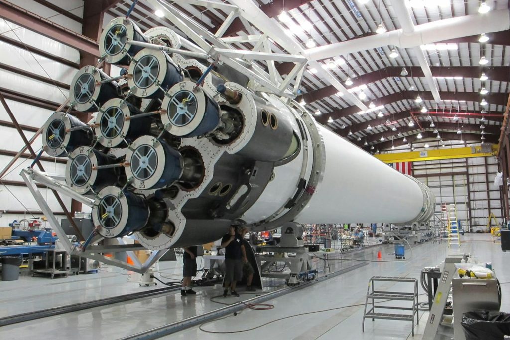 Low angle of innovative rocket core detail under construction at modern futuristic industrial factory