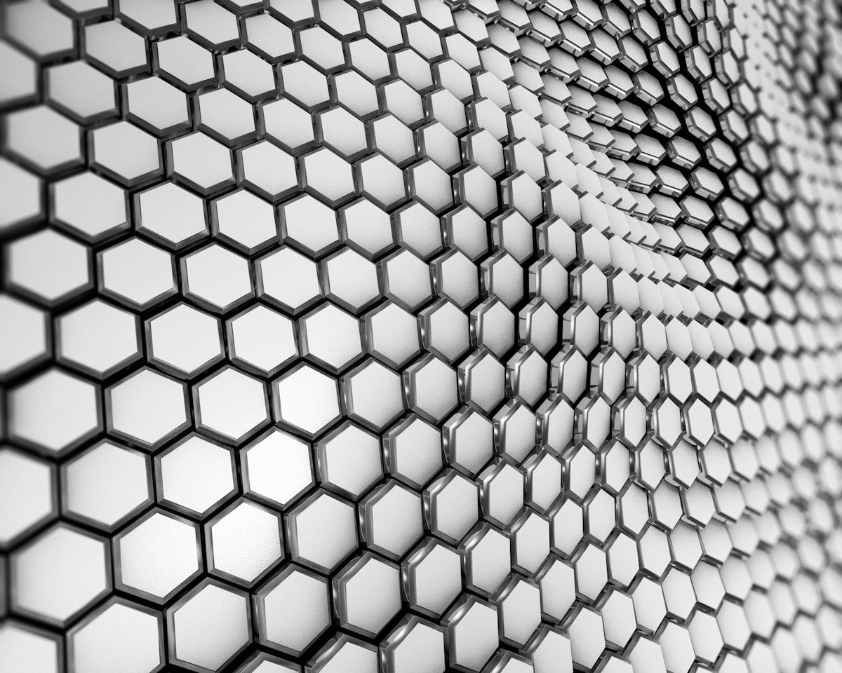a black and white photo of a large group of small circles
