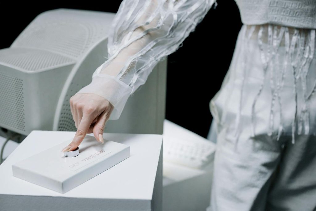 Woman in sleek attire operates cutting-edge laboratory equipment in a tech-focused environment.