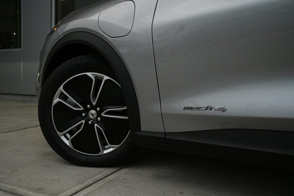 a close up of a car tire on a sidewalk