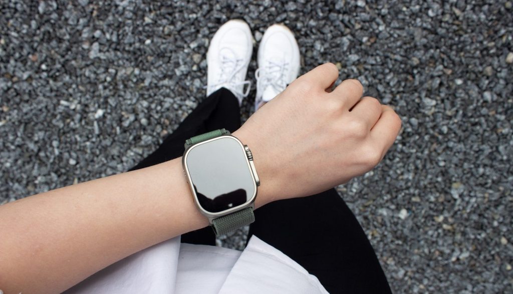 a person's hand wearing a watch
