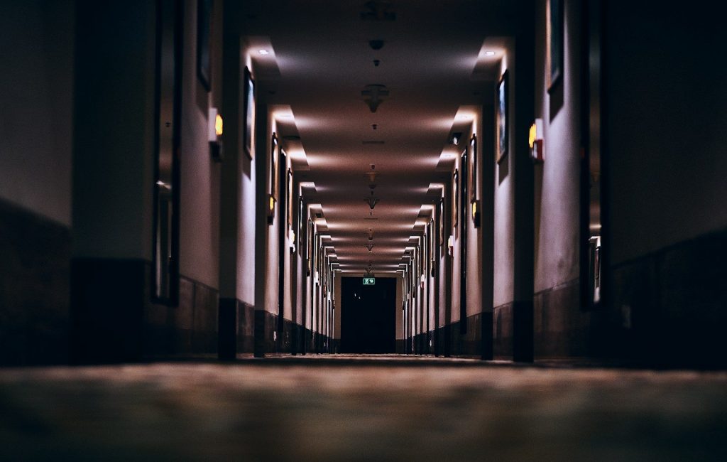 hallway with lights turned on in a hallway