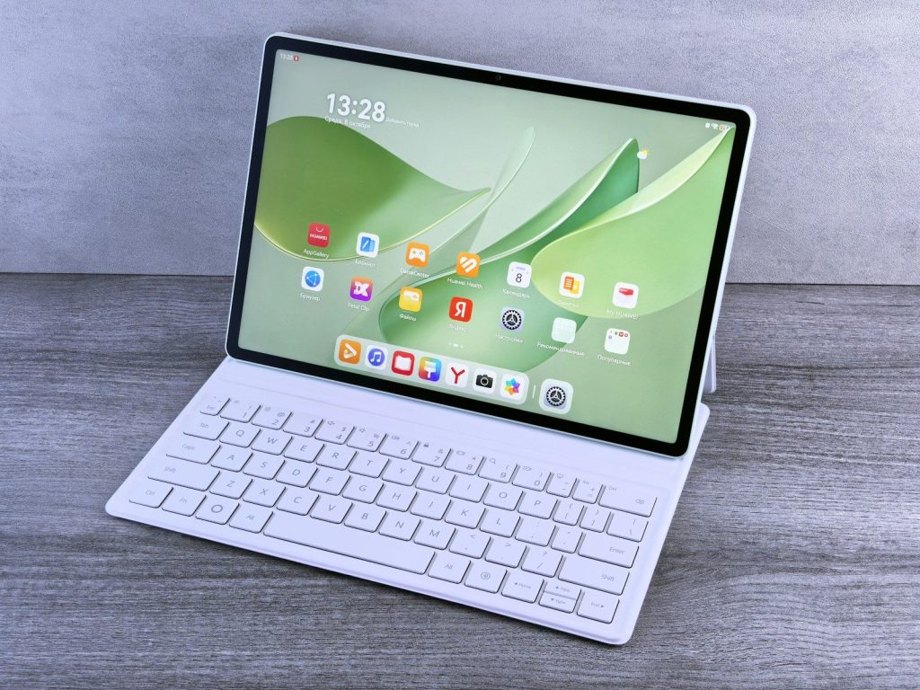 Modern tablet with keyboard and colorful app icons.