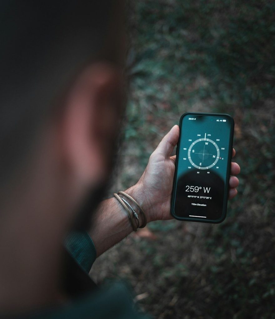 A person holding a cell phone in their hand