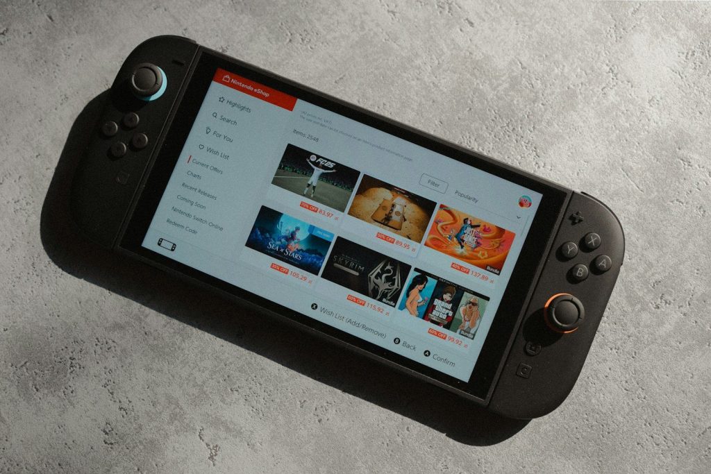 Handheld gaming console displaying a video streaming service.