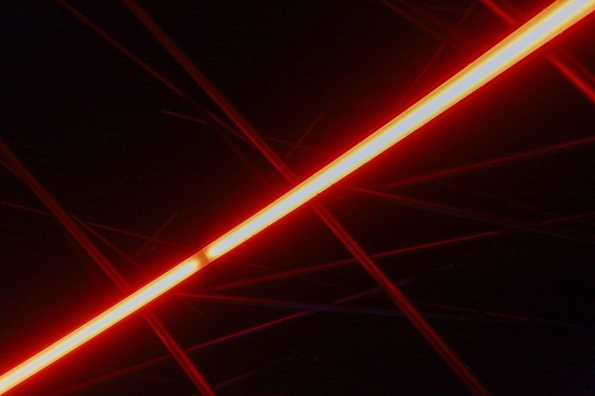A close up of a red light in the dark