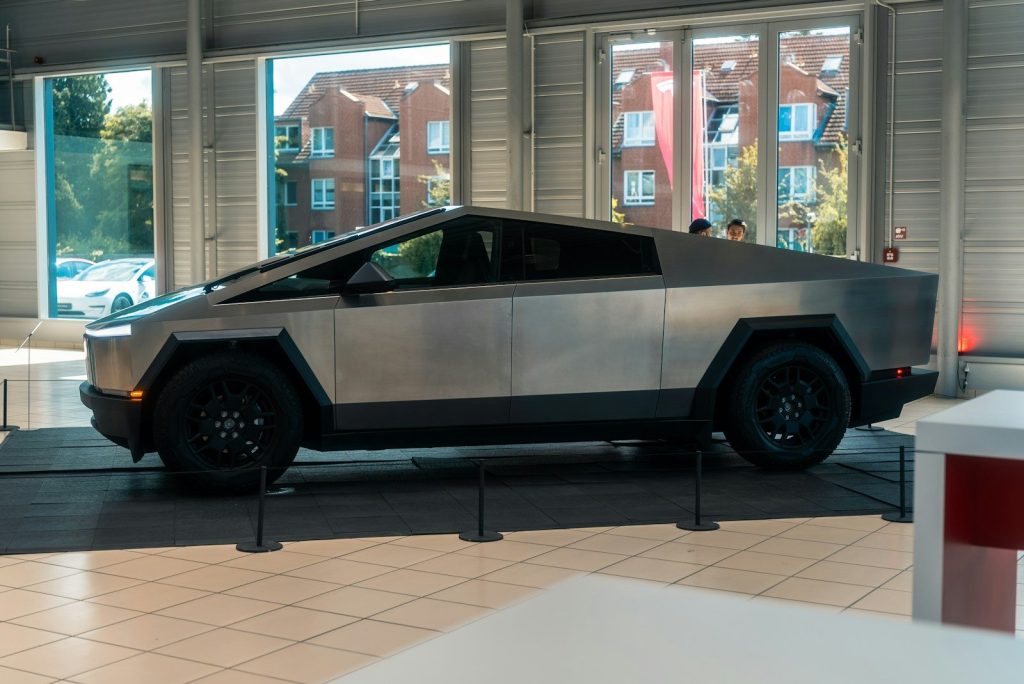 A futuristic car is on display in a building