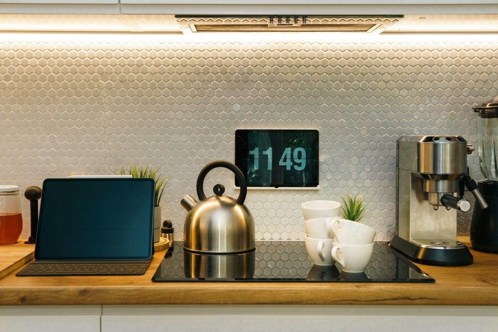A modern kitchen with various electronic devices.