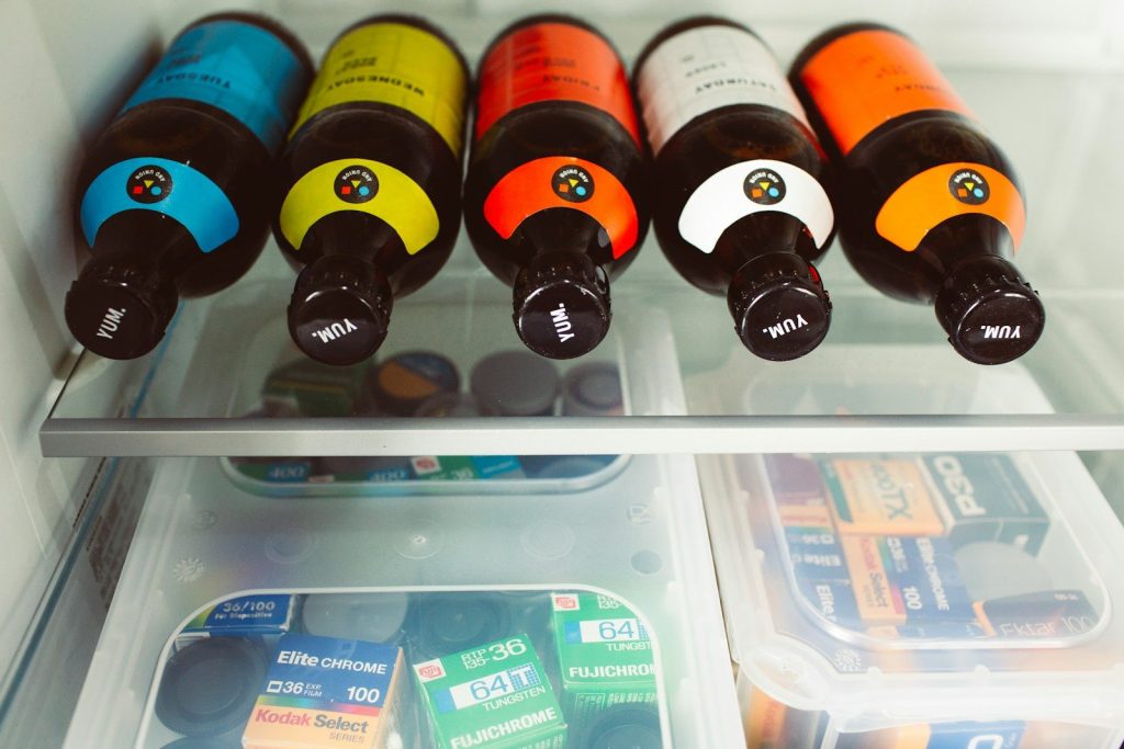 a refrigerator filled with lots of bottles of wine