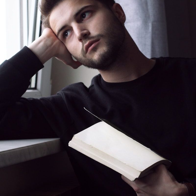 man holding a book