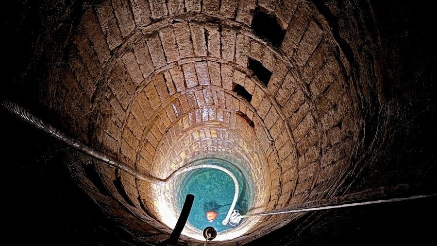 a man standing in the middle of a tunnel