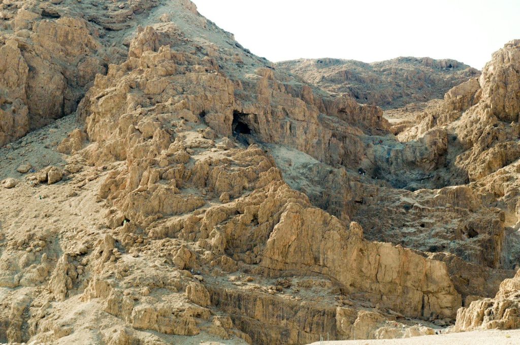 Rocky desert canyon with caves and arid landscape
