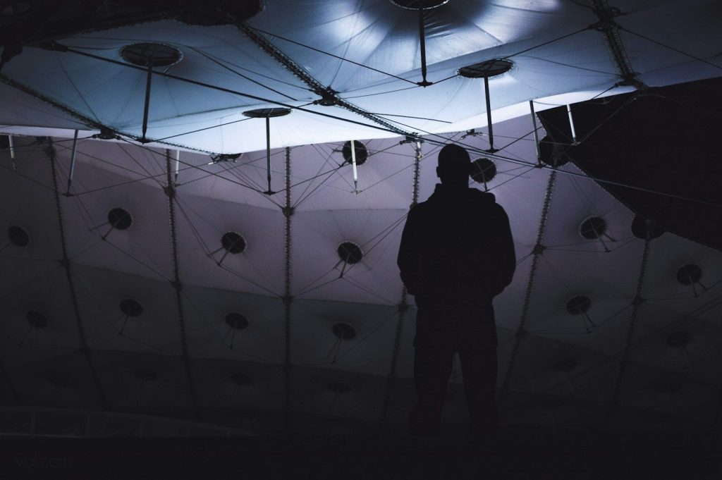 silhouette of man inside studio