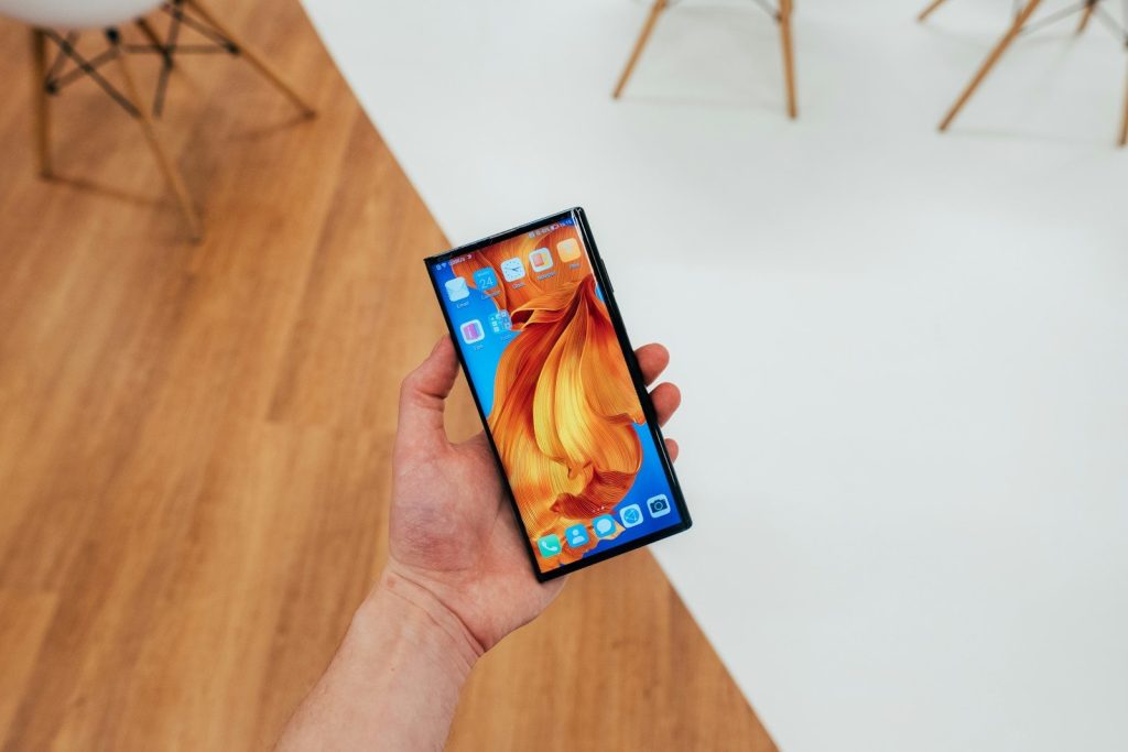 person holding black android smartphone