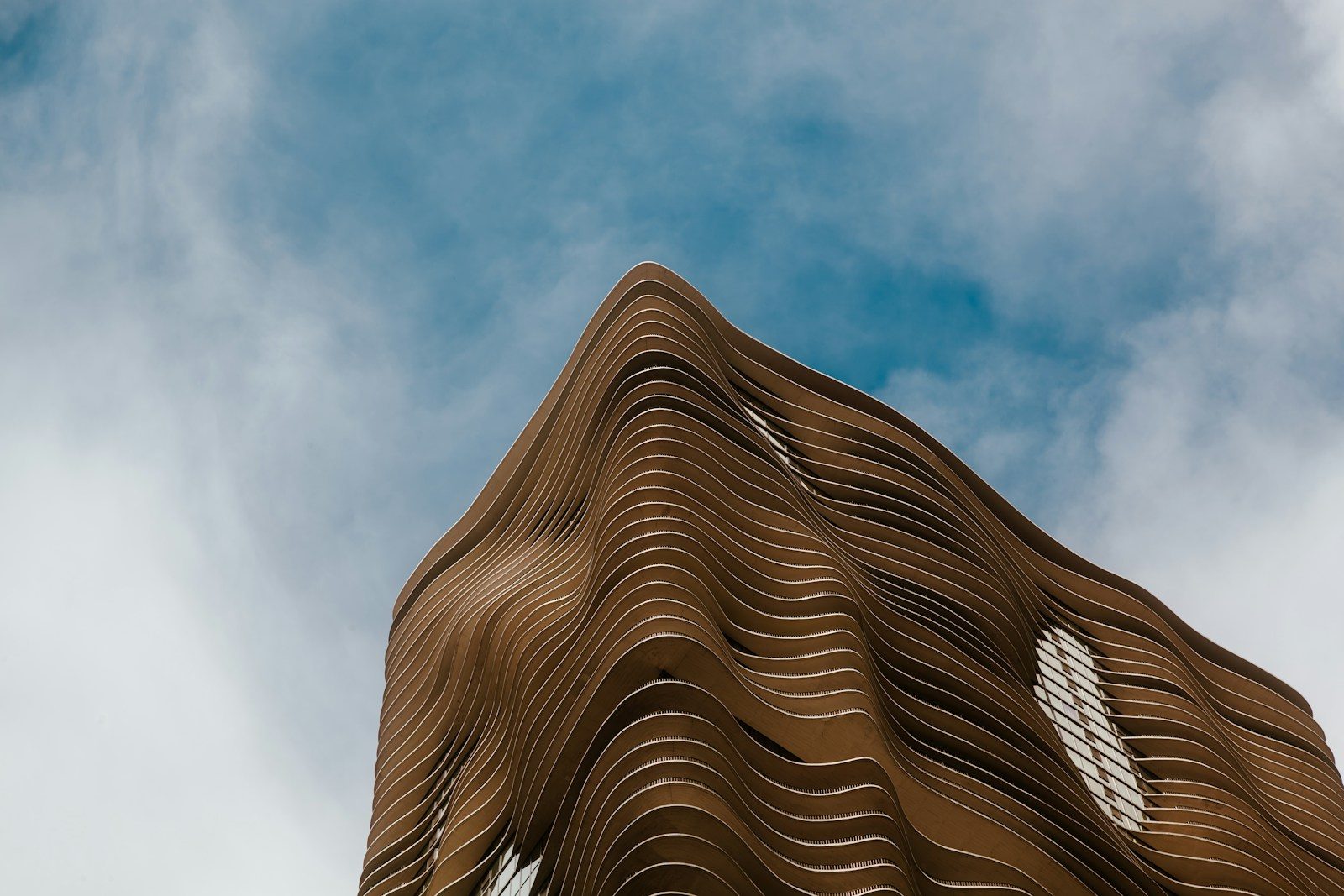 A tall building with a sky in the background
