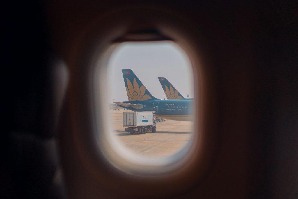 a view of the wing of a plane through a window