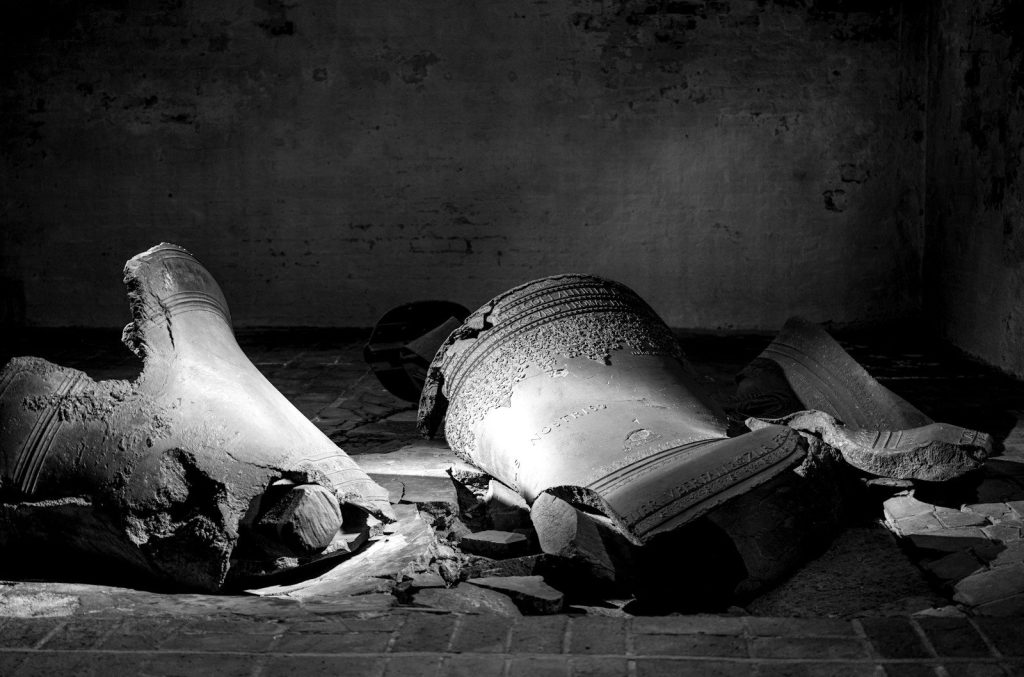a black and white photo of a broken vase