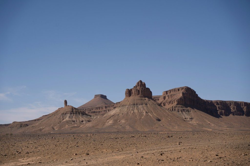 Rocky desert landscape under a clear blue sky