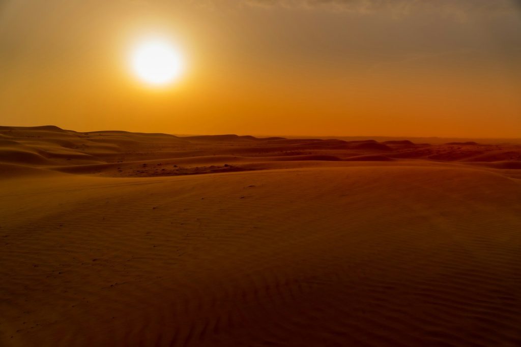brown sand under sunny sky