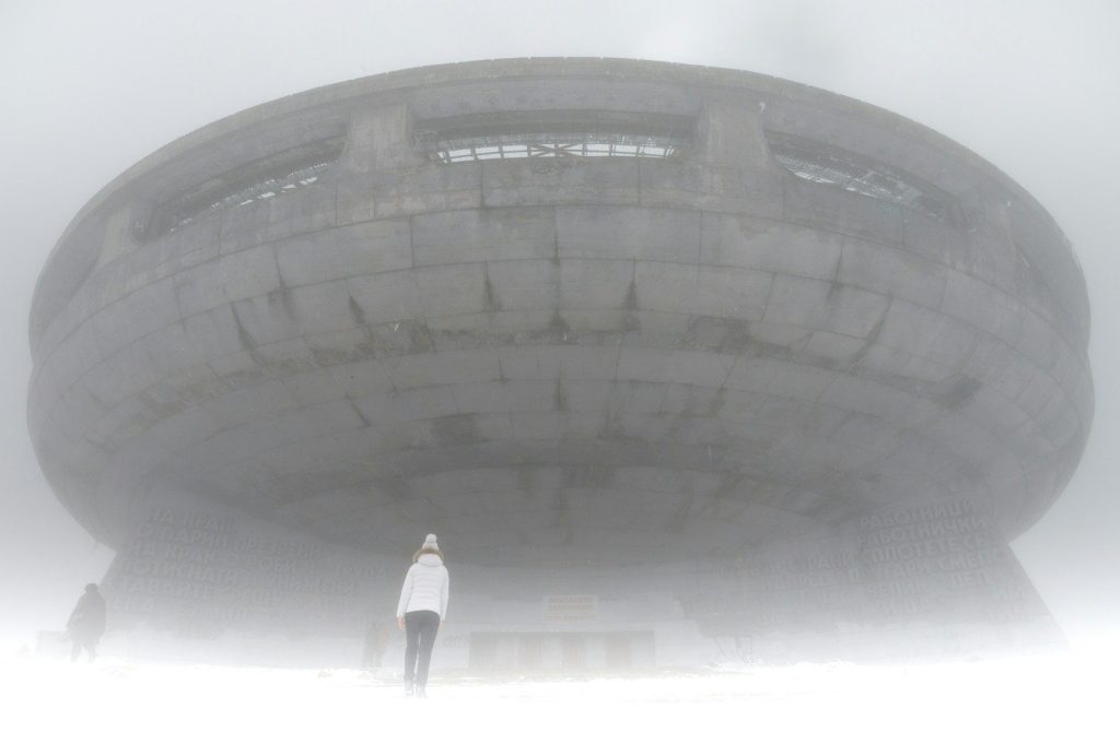 A large object in the middle of a foggy sky