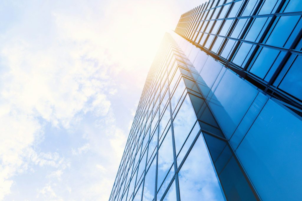 low-angle photo of curtain wall building