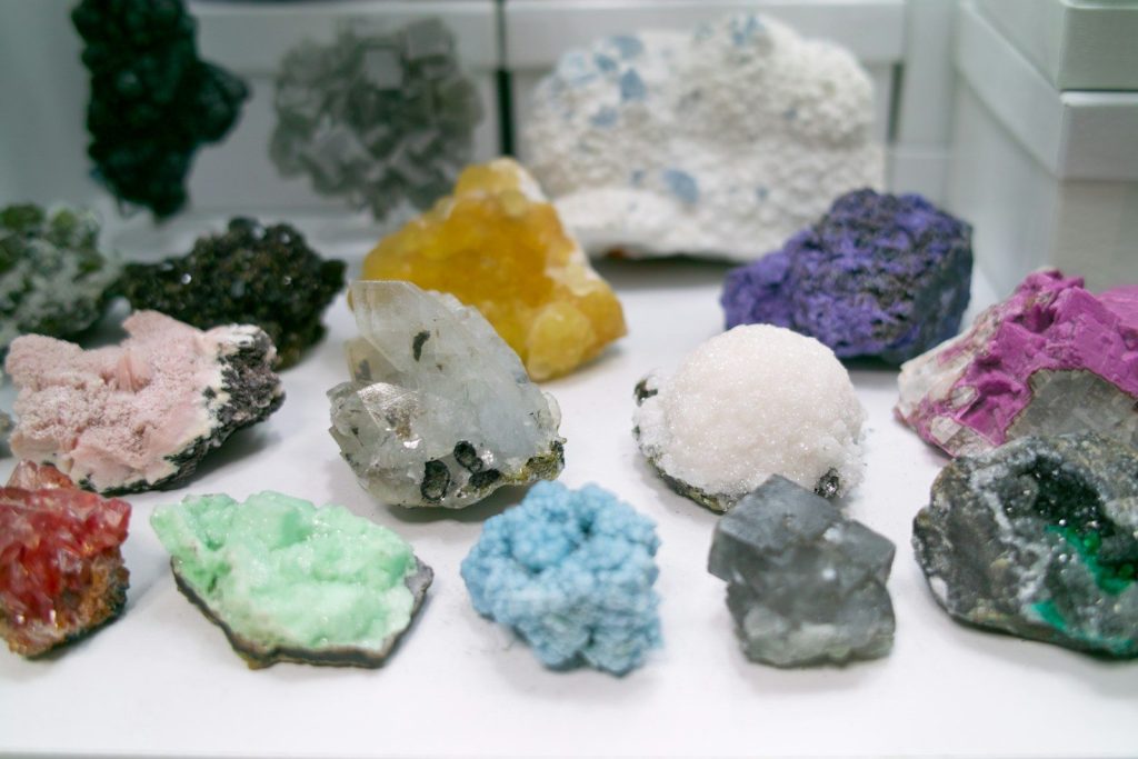 a bunch of different colored rocks on a table