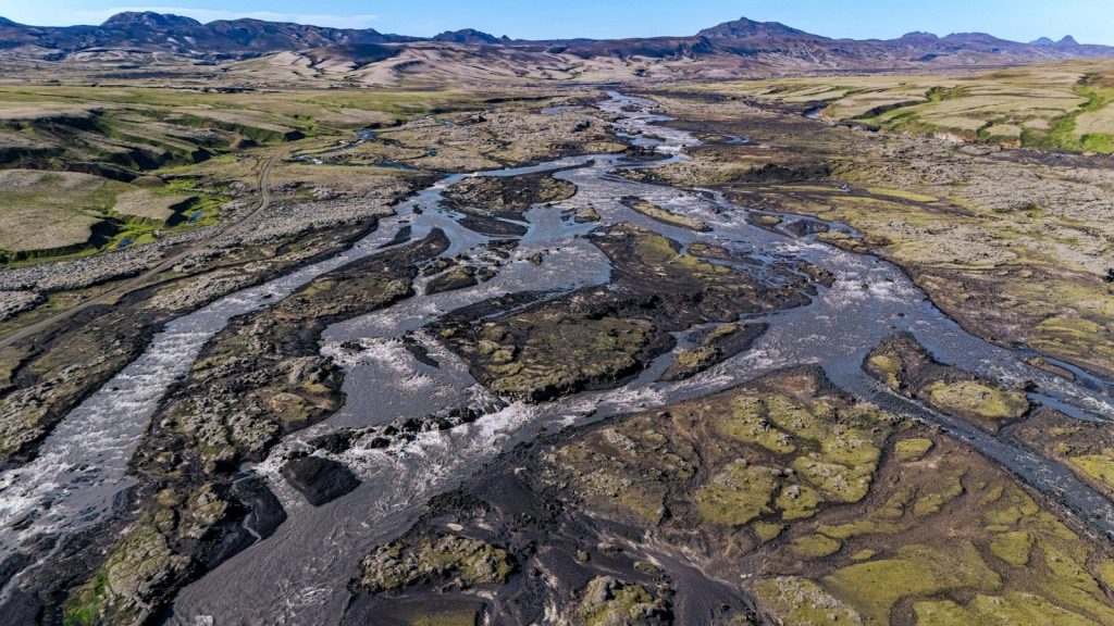 An aerial view of a river running through a valley