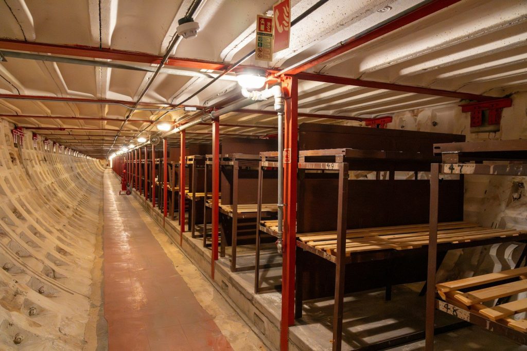 a long row of benches inside of a building