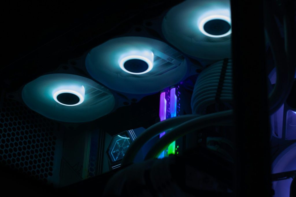 A close up of a computer tower in the dark