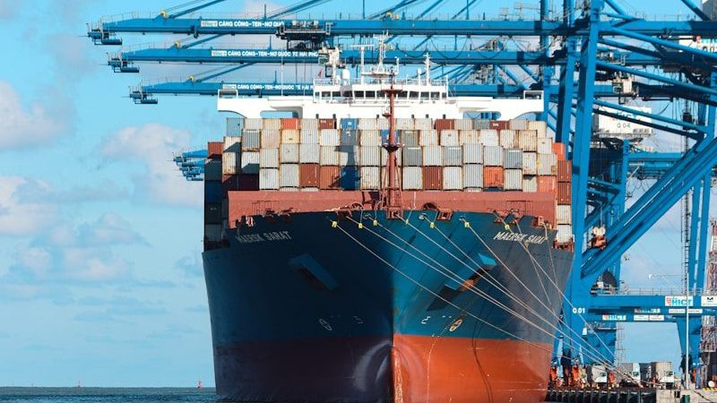 a large cargo ship at a dock