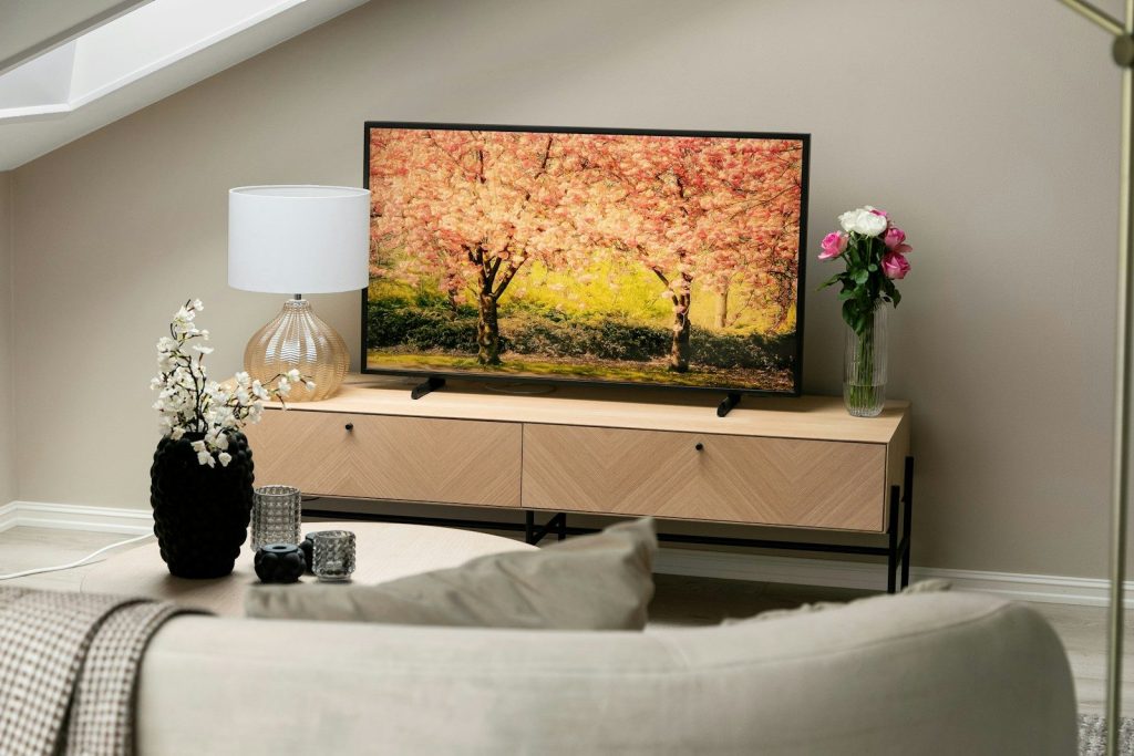 A flat screen TV sitting on top of a TV stand