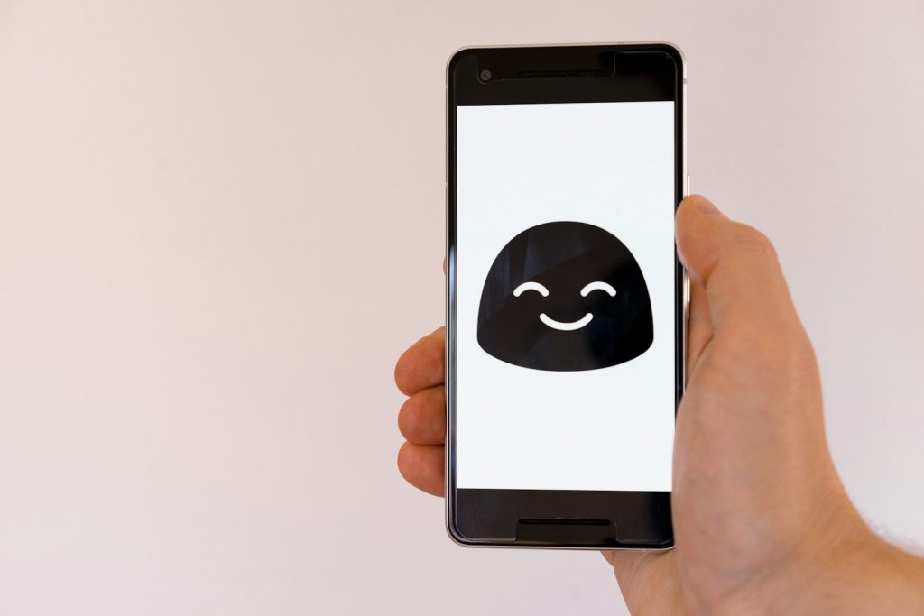 person holding black iphone 7