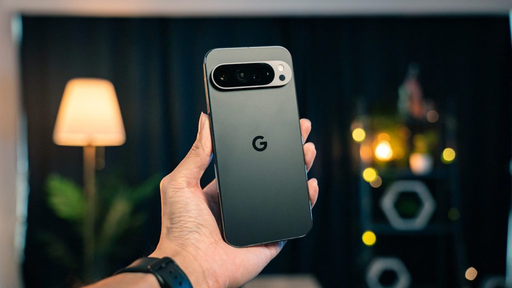 A person holding a cell phone in their hand
