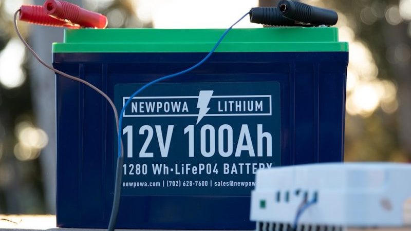 a battery and a charger sitting on a bench