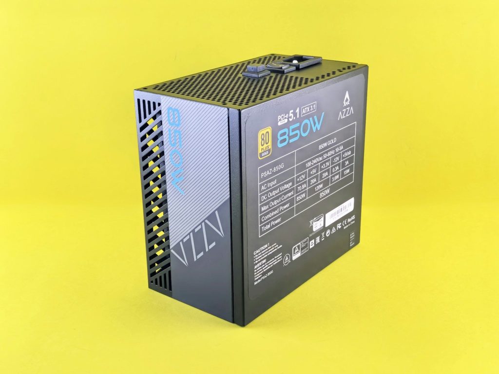 A black electronic device on a yellow background