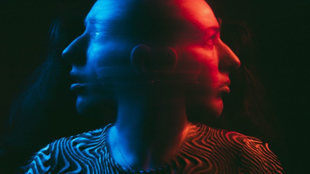 a man and a woman with ear phones in their ears
