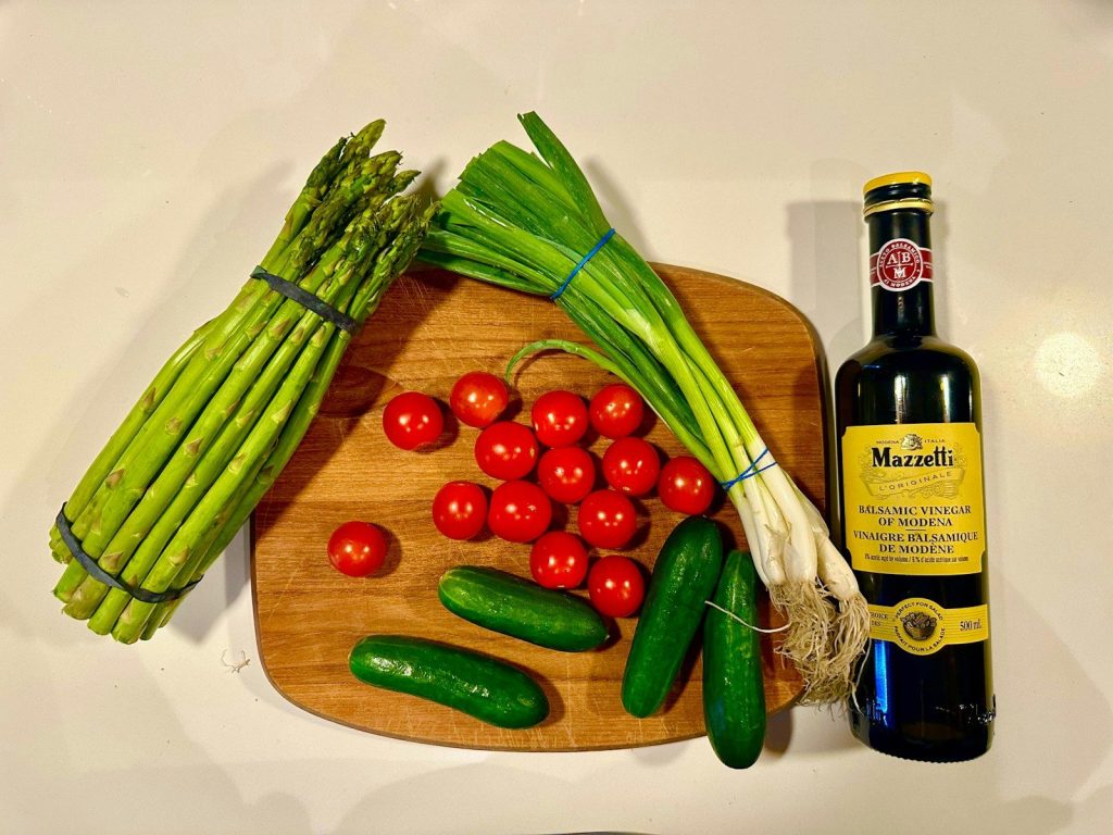 Fresh vegetables and a bottle of wine.