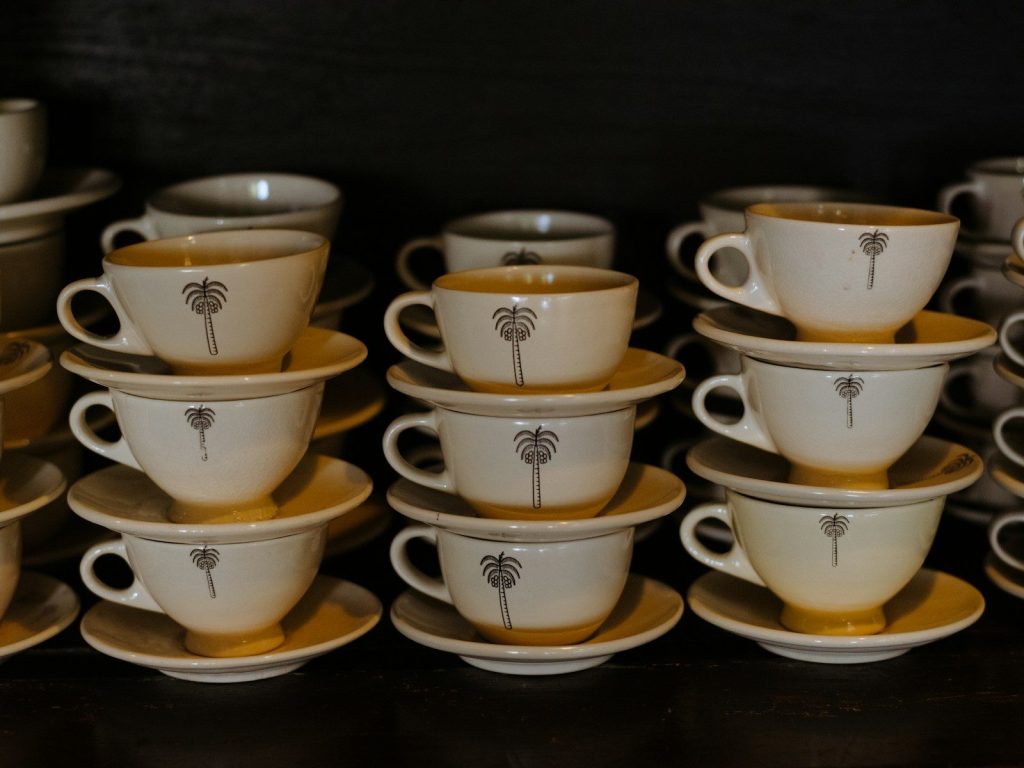 A table topped with lots of cups and saucers