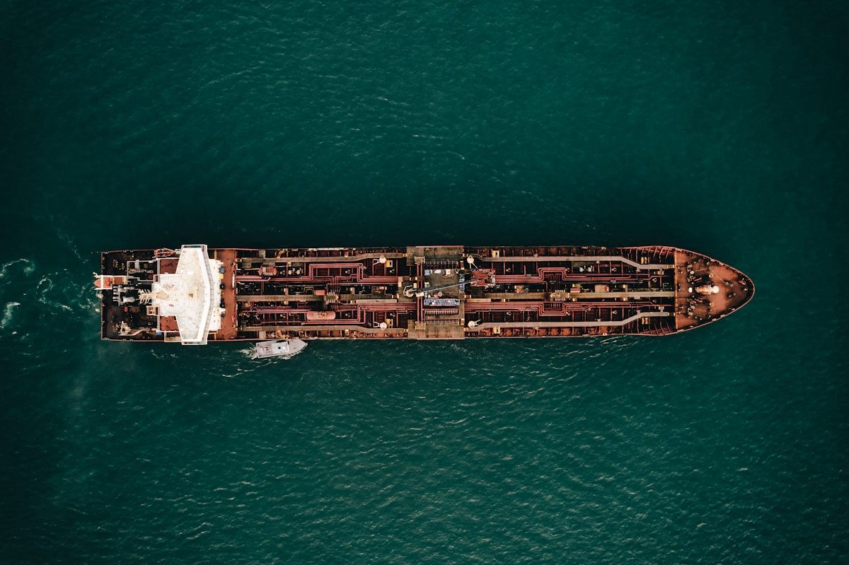 aerial view of brown and white building on body of water during daytime
