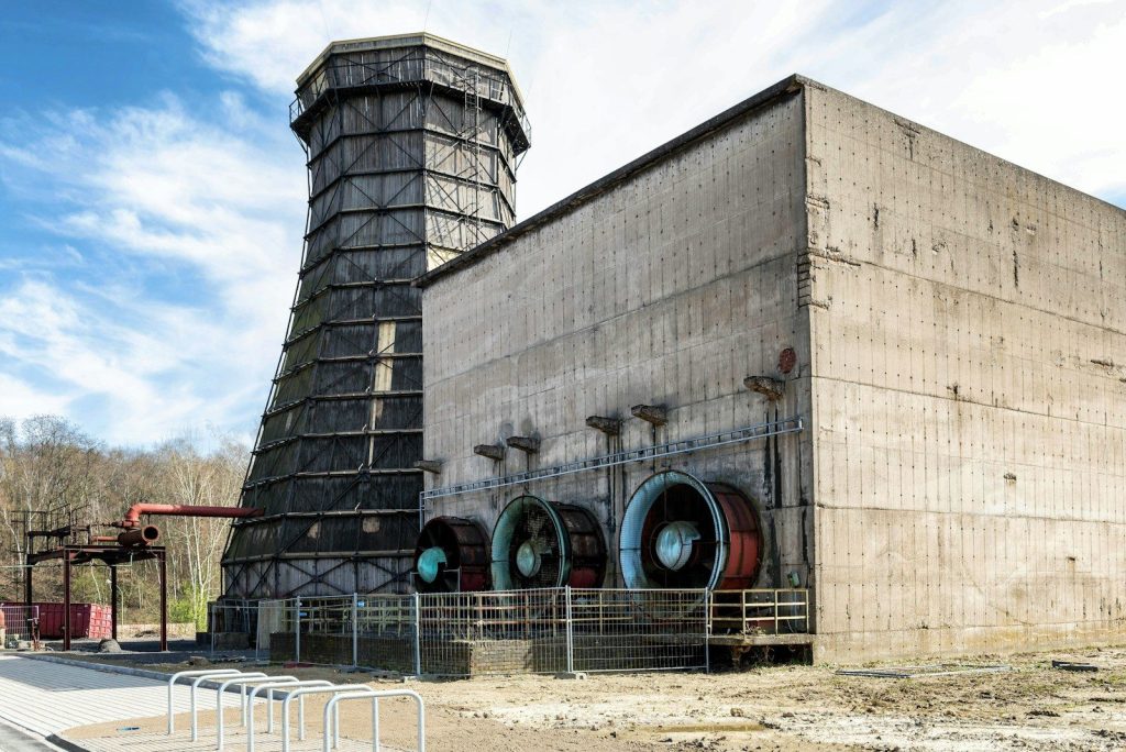 Industrial cooling tower with large fans on concrete building