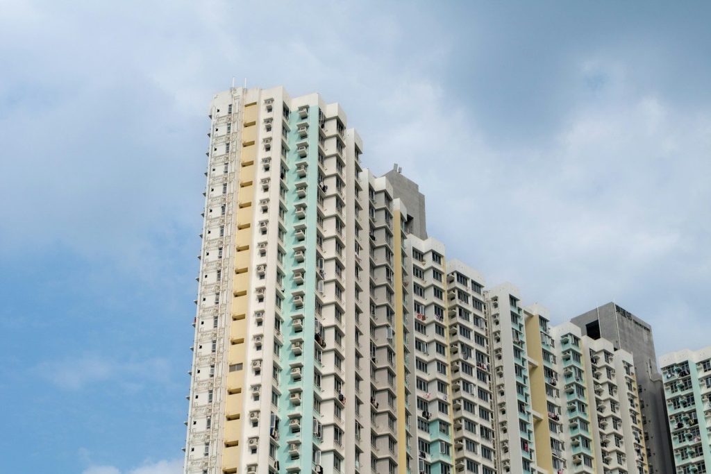 Tall apartment buildings against a cloudy sky