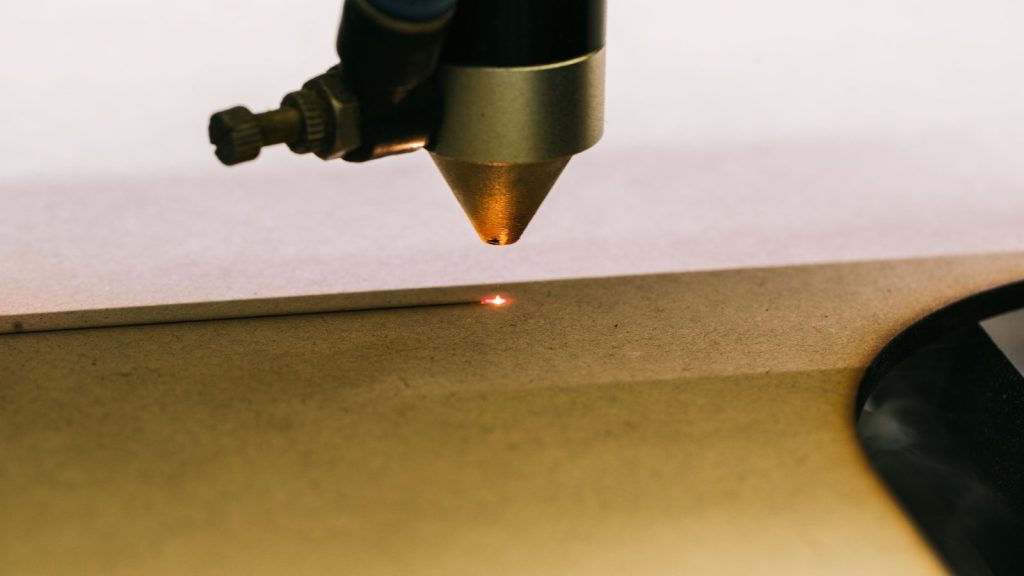 a close up of a metal object with a light on it