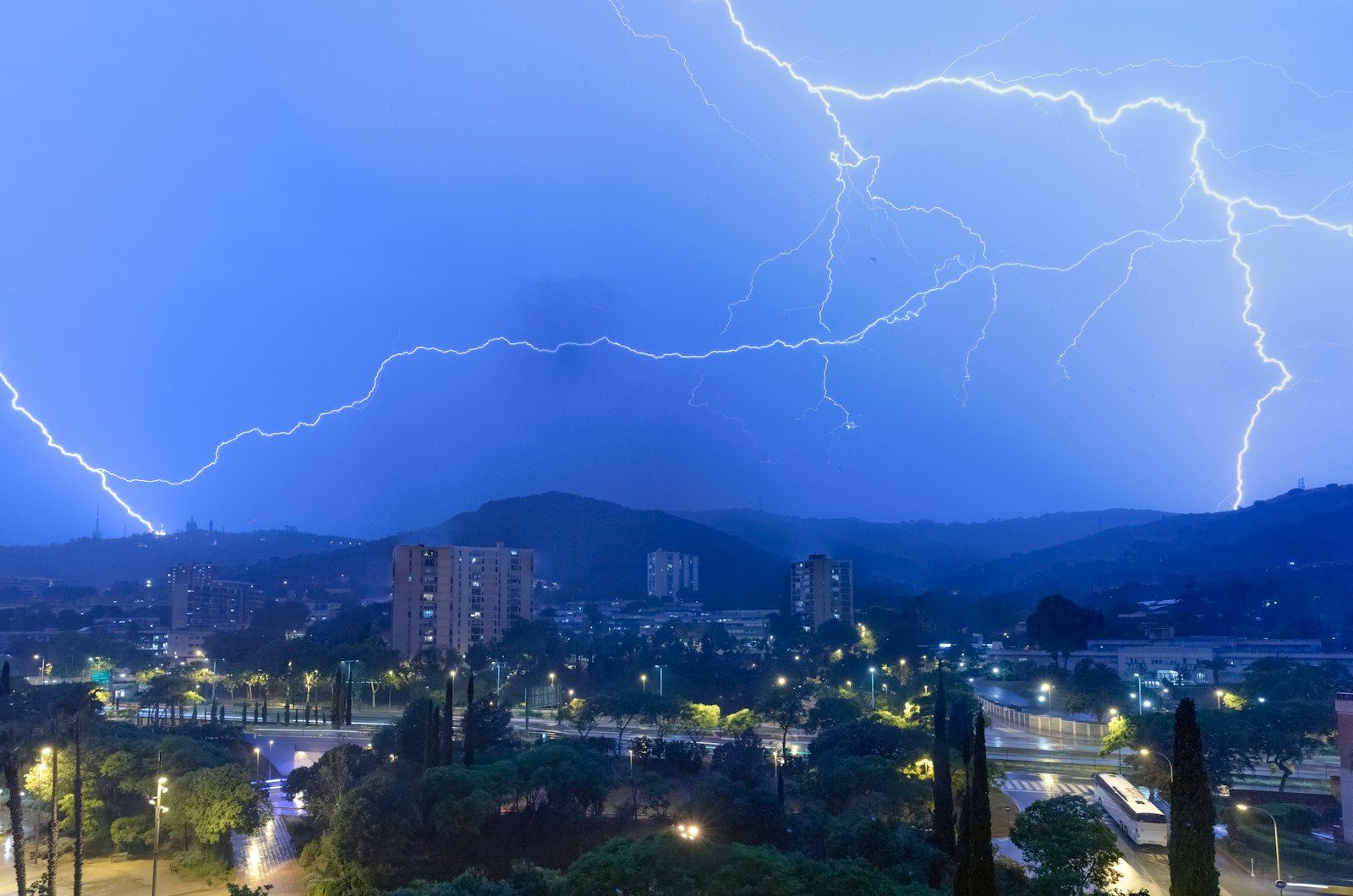 a lightning storm over a city at night